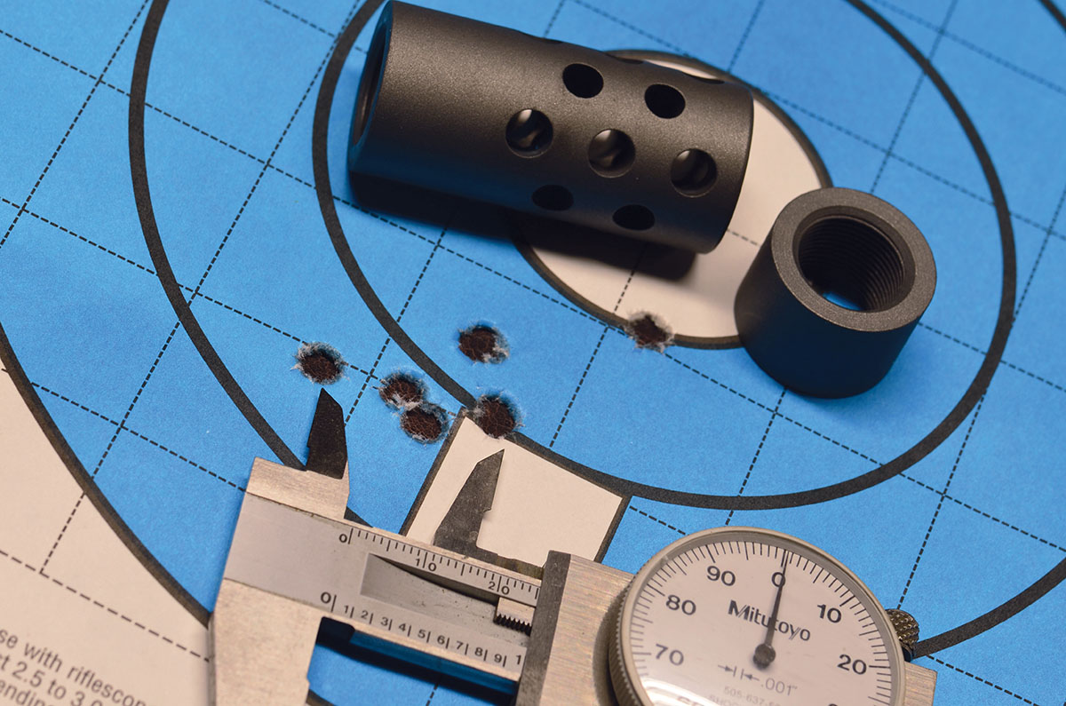 With and without the muzzle brake, a composite group measuring 1.815 inches. The flyer was one of three shots with the brake on while, without the brake, three shots printed in the center of the existing group.